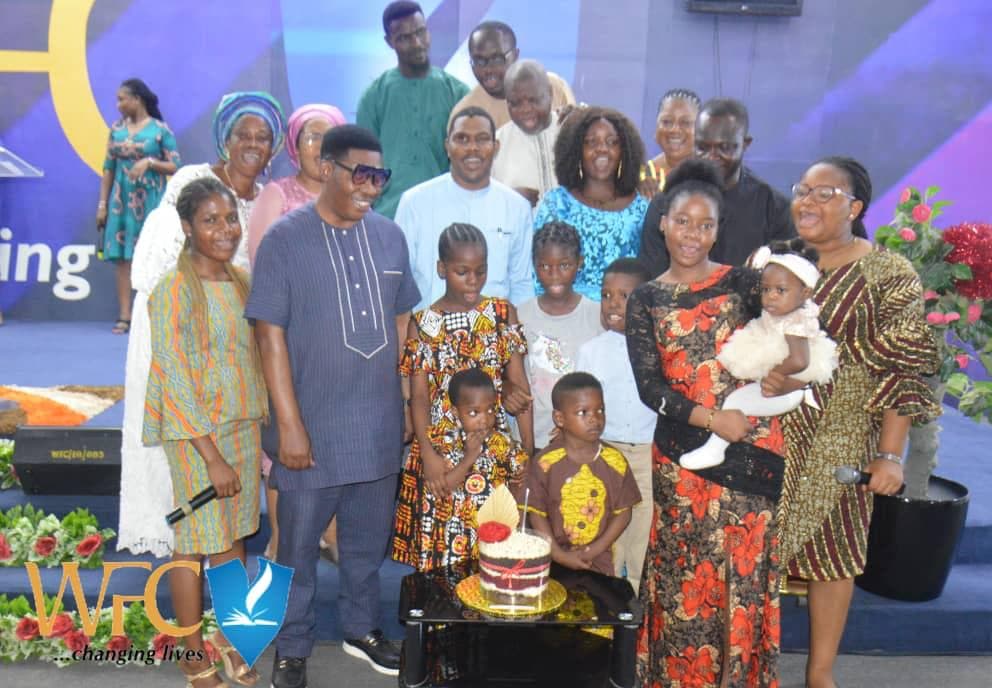 Family birthday celebration with children on stage