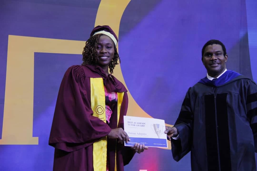 Graduation ceremony with academic regalia on stage