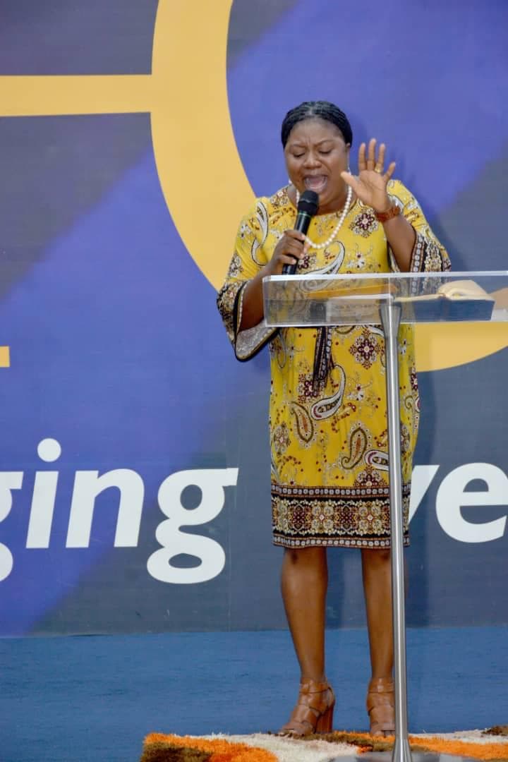 Woman with hands covering her face in tearful intercession