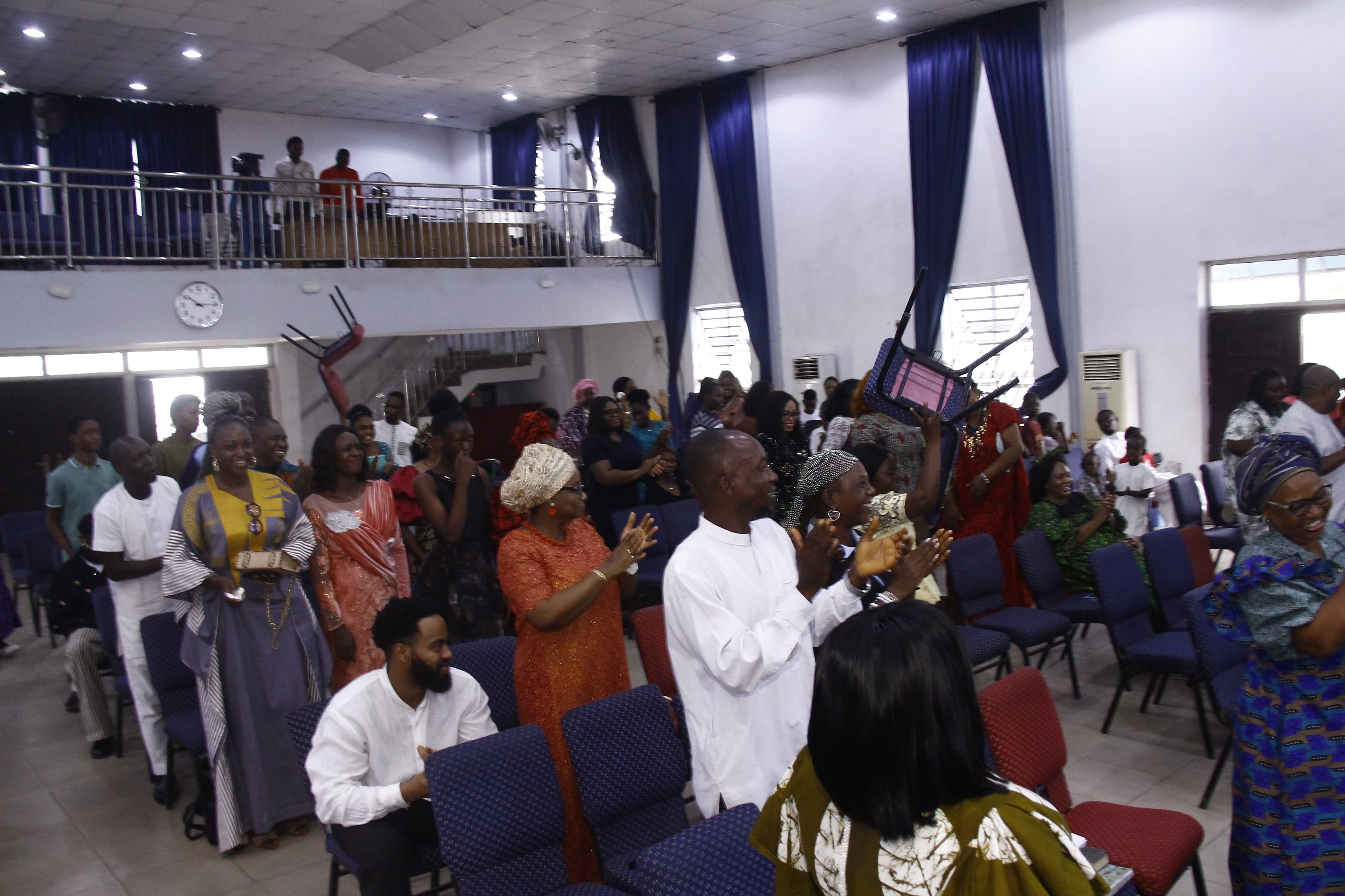 Full church interior from elevated angle during worship