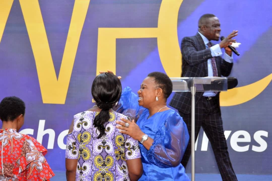 Congregation worshipping with hands raised