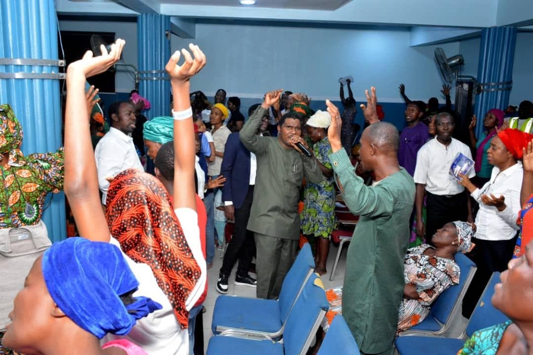 Congregation with raised hands during worship